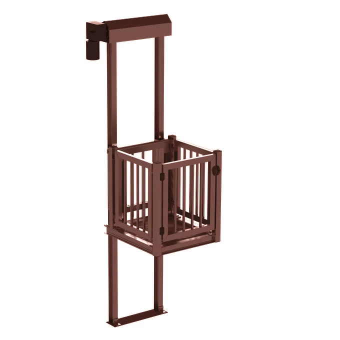Brown cage-style home elevator with vertical lift frame and safety gate.