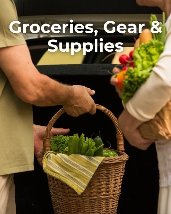 Two people carrying baskets of fresh groceries and vegetables, with text "Groceries, Gear & Supplies" above.